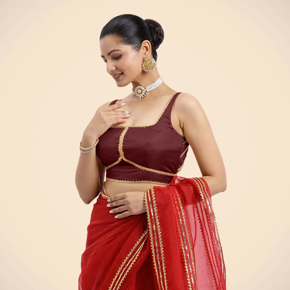 Arya x Tyohaar | Burgundy Sleeveless FlexiFit™ Saree Blouse with Square Neck and Back Window Embeliished with Golden Gota and Pearl Lace