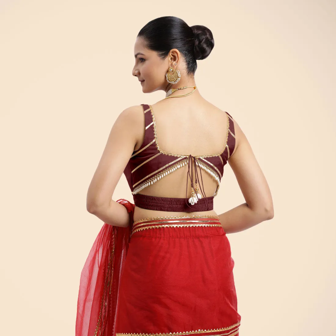 Arya x Tyohaar | Burgundy Sleeveless FlexiFit™ Saree Blouse with Square Neck and Back Window Embeliished with Golden Gota and Pearl Lace