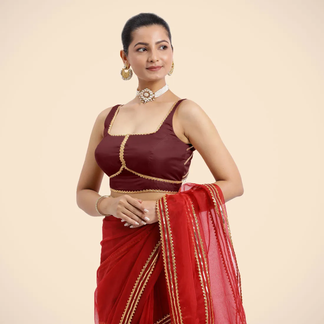 Arya x Tyohaar | Burgundy Sleeveless FlexiFit™ Saree Blouse with Square Neck and Back Window Embeliished with Golden Gota and Pearl Lace