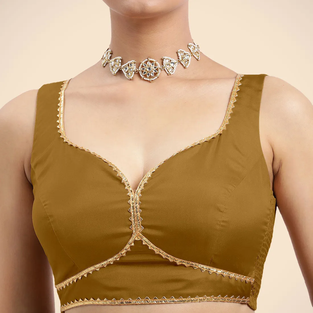 Ishika x Tyohaar | Bronze Gold Sleeveless FlexiFit™ Saree Blouse with Beetle Leaf Neckline with Golden Gota Lace and Back Cut-out with Tie-Up