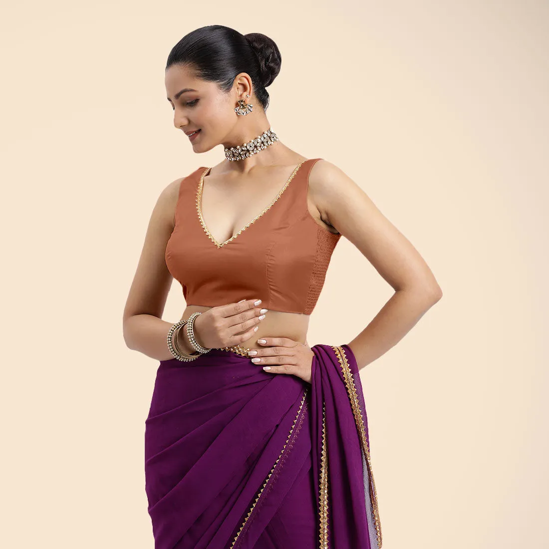 Raisa x Tyohaar | Metallic Copper Sleeveless FlexiFit™ Saree Blouse with V Neckline with Golden Gota Lace Embellishment and Back Cut-out with Tie-Up