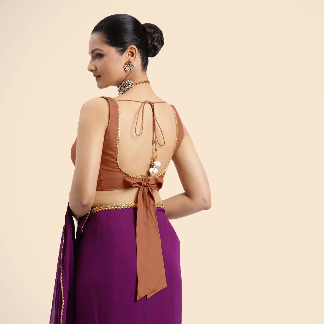 Raisa x Tyohaar | Metallic Copper Sleeveless FlexiFit™ Saree Blouse with V Neckline with Golden Gota Lace Embellishment and Back Cut-out with Tie-Up